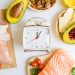 An array of some best foods that can break an intermittent fast, plus a timer.