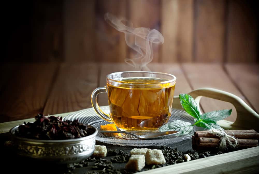 A closeup of some tea in a clear cup.